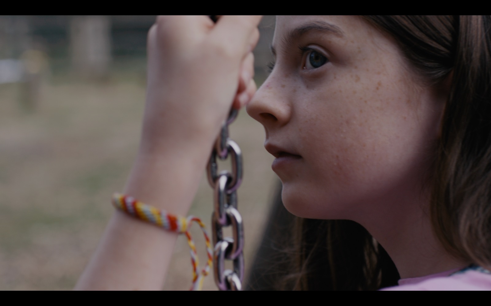 Film still — Megan on swing